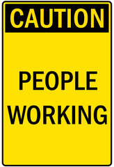 Men working above sign