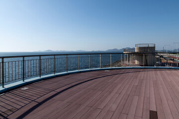 Seascape with the observatory and horizon on a sunny day