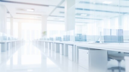 Blurred background of white modern interior office, rows of computer tables and chairs.
