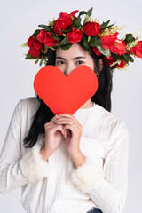 woman hoad cartoon red heart paper, put rose on head stand white background,for good health or tell love in valentine day.