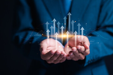 Growth planning and business strategy. Businessman holding financial growth chart increased income....