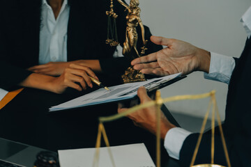 Judge gavel with Justice lawyers having team meeting at law firm background. Concepts of Law and...