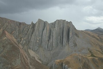 Stunning image of a mountain, towering majestically beneath a dramatic cloudy sky