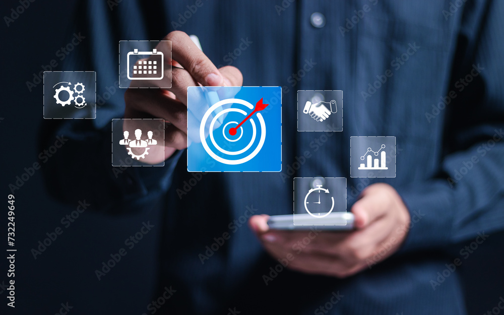 Poster targeting business concept. businessman use smartphone with virtual target icon for strategic planni
