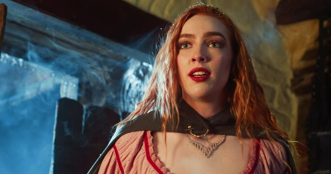 Young noblewoman asks for help in tavern on winter day. Worried fugitive princess with blonde loose wet hair reports yelling about danger to pub guests. Medieval lifestyle
