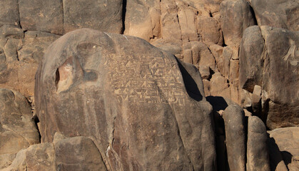 ancient egyptian hieroglyphs carved on the rocks
