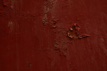 Dark red painted old wall plaster texture background