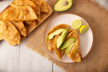 Pescadillas. So called when they are stuffed with fish such as tuna, popular during the Lent season. They are known as Golden Quesadillas when they are filled with ingredients such as meat or potatoes