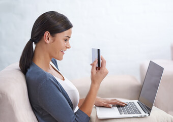 Woman, laptop and credit card with living room, online shopping and ecommerce. Blogger, computer and payment for review or sales and blog for retail, technology and sofa with smiling customer