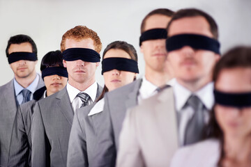 Business people, blindfold and employees lost at work, together and coworkers trust in workplace....