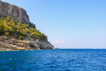 View of the rocky shore from the sea. Mediterranean Sea in Turkey. Popular tourist places. Background