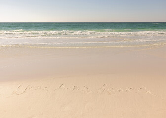 Fototapeta na wymiar Florida Beach Ocean on a sunny bright day YOU are LOVED