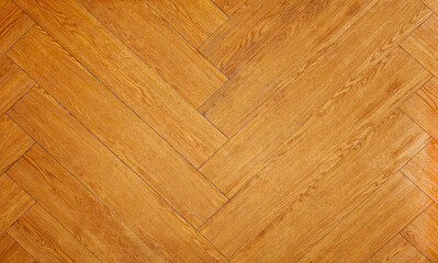 Fototapeta premium High-quality oak wood flooring in a herringbone pattern with a warm, inviting texture, suitable for any interior