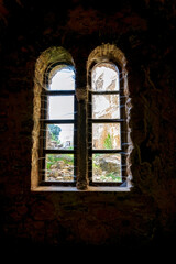 Windows inside the monastery enclosed by Davelis cave in Penteli, a mountain to the north of Athens, Greece