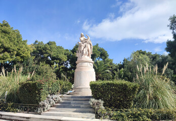 The Statue of Byron is depicting Greece in the form of a half-naked seated woman crowns Byron with a palm branch as a sign of gratitude for his services to her.