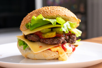 Close up of home made burgers with salad and tomatoes