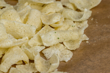 crispy potato chips with spices on the table