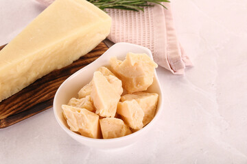 Chopped Italian hard parmesan cheese