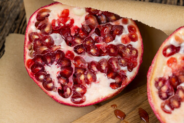 juicy pomegranate on a wooden board