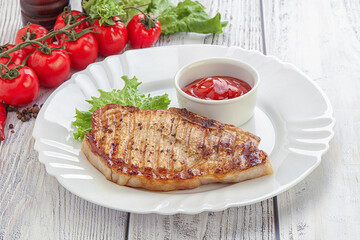 Grilled pork steak with ketchup