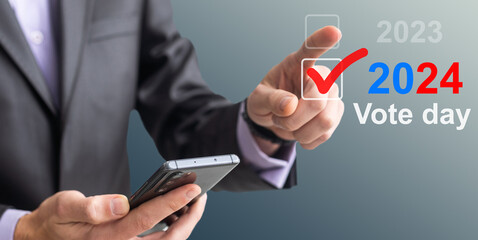 Businessman pressing an Election 2024 concept button.