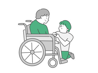 女性介護士と車椅子に乗った高齢女性