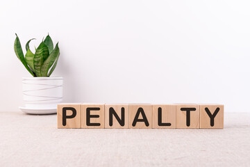 PENALTY word made with building blocks on a light background