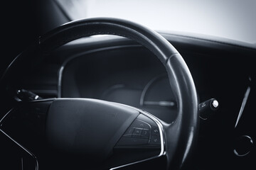 Modern car cockpit dashboard close-up.