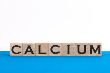 Calcium word concept on a blue light background