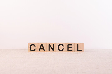 CANCEL word made with building blocks, business concept