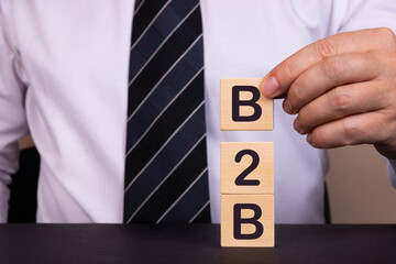 Man made words B2B with wood blocks.