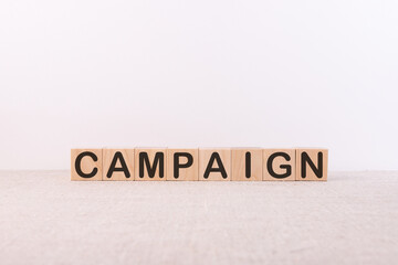 CAMPAIGN word made with building blocks on a light background