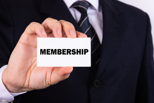 Businessman holding a card with text Membership