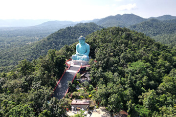 Outdoor great Buddha Daibutsu or Amitabhe Buddha at Wat Pra That Doi Pra Chan. It is a green rust...