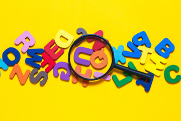 English letters scattered on yellow background. Ideas for developing grammatical thinking and...