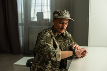 Fototapeta premium The soldiers - our pride. Special forces soldier with rifle on dark background. Modern soldier with rifle