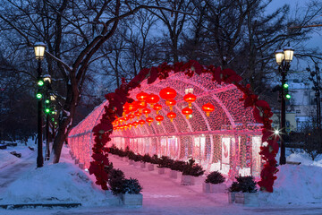 Chinese New Year in Moscow. The glowing tunnel with red decorative lanterns on Tverskoy Boulevard - 732373219
