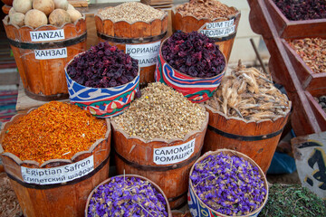 Street bazaar on an Egyptian street with dried flowers and leaves of various kinds of tea, chamomile, saffron, Dahab, Egypt