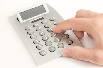 Male hand and calculator on white background
