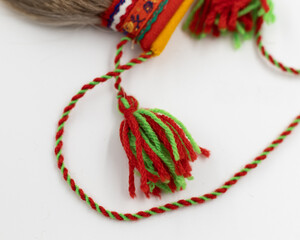 Tassels and a twisted two-tone strap of a Sami bag made of reindeer fur