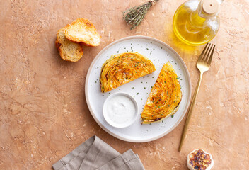 Cabbage steaks with white sauce. Healthy eating. Vegetarian food.
