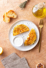 Cabbage steaks with white sauce. Healthy eating. Vegetarian food.