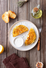 Cabbage steaks with white sauce. Healthy eating. Vegetarian food.