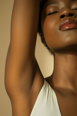 A young African American woman shows her shaved armpit. Body care concept
