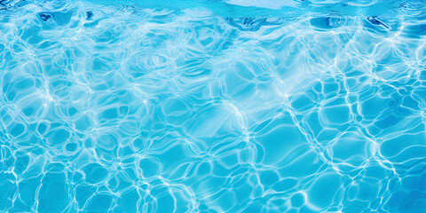 Water in swimming pool blue background Beautiful Gentle wave in swimming pool with sun reflection.