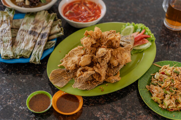 Fried Gourami Fillet With Sauce. Deep Fried Gourami Fillet.