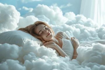 Fotobehang Happy Young beautiful woman sleeps and resting on a bed with a soft white dazzling pillows that float in the soft clouds. © PELK