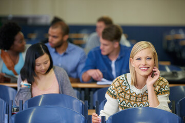 University, students and happy portrait in lecture, classroom and learning in course for education. College, campus and people studying for test in school and reading project, research or knowledge