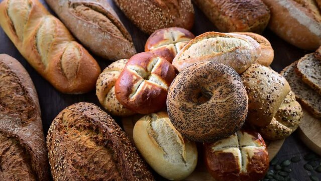 Assorted bakery products including loaves of bread and rolls