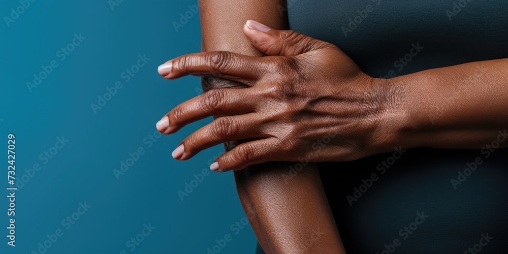 Poster hands of a person captured in a close-up shot against a vibrant blue background. versatile image sui
